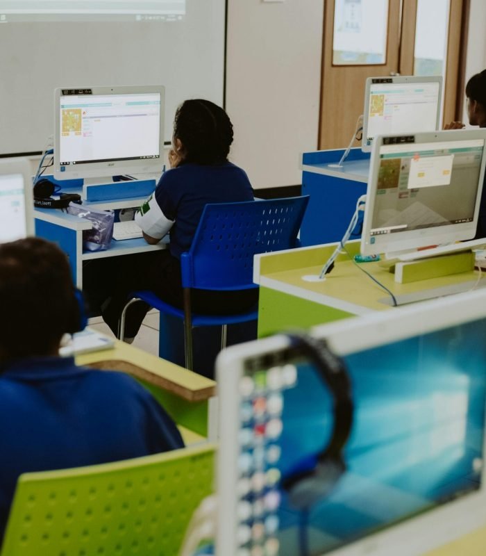 Students using computers in their class